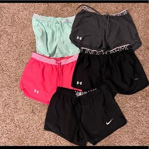 Bundle of 4 underarmour shorts and Nike shorts